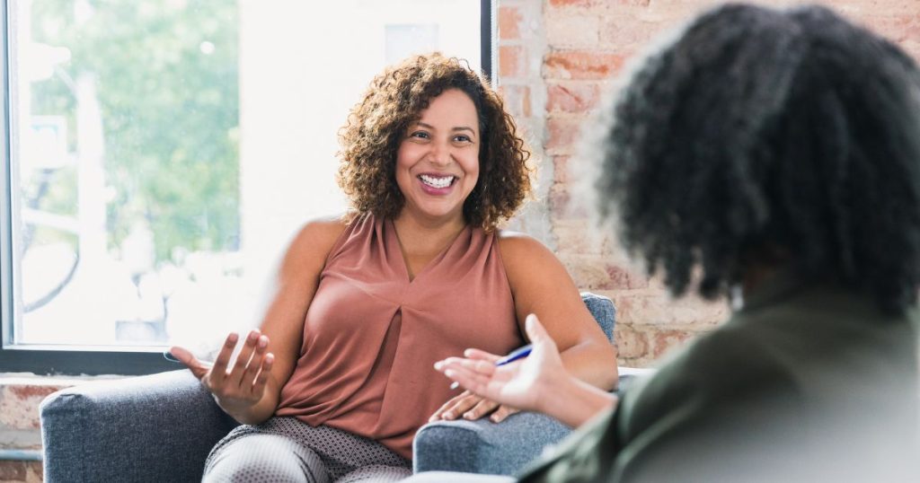 A woman having a consultation for NAD= for Anti-aging treatment in Asheville, NC, at Hydrate Medical.